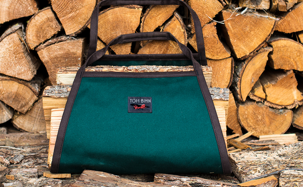 A Firewood Carrier in Forest Green #8 Cotton holding firewood.